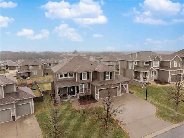 view of front of property featuring a garage and a front yard