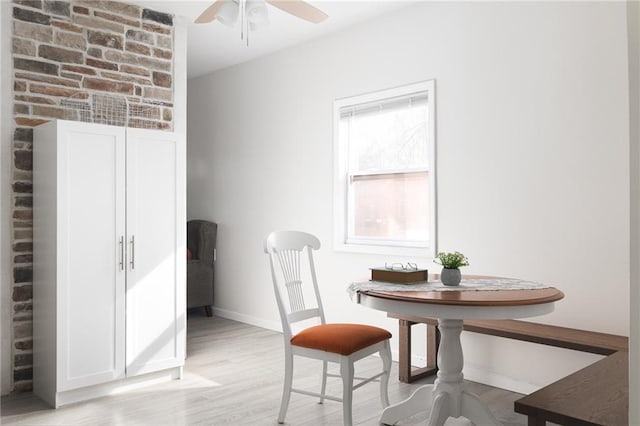 dining area featuring ceiling fan and light hardwood / wood-style flooring