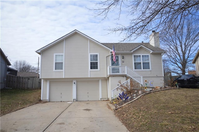 view of front of home with a garage and a front lawn