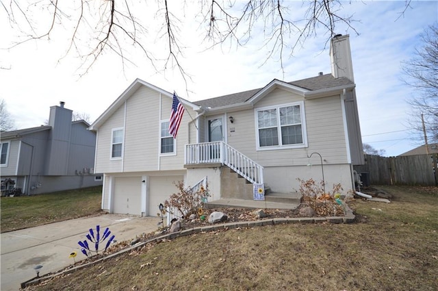 view of front of house with a garage and a front yard