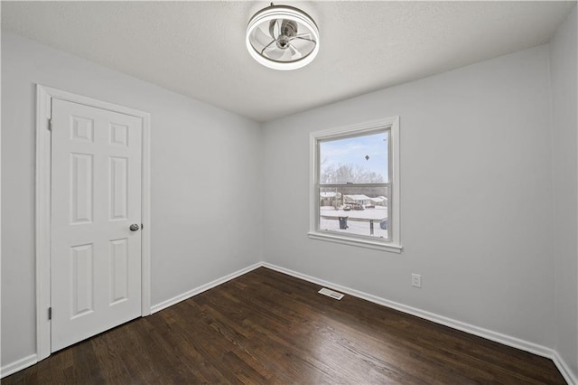 empty room featuring hardwood / wood-style flooring