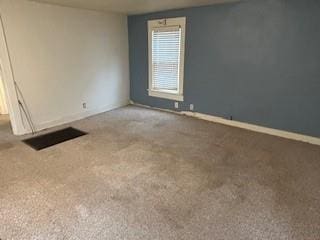 spare room featuring carpet flooring