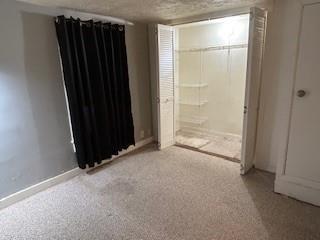 unfurnished bedroom featuring light colored carpet