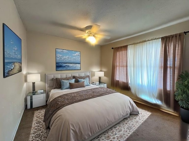 3311 Flora Ave, Kansas City, MO 64109 - bedroom with carpet flooring, ceiling fan, a textured ceiling, and baseboards