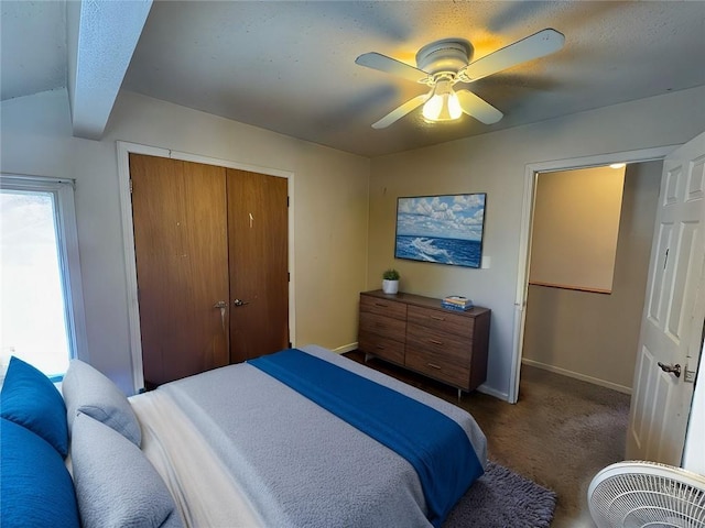 3311 Flora Ave, Kansas City, MO 64109 - bedroom featuring carpet floors, a closet, ceiling fan, and baseboards