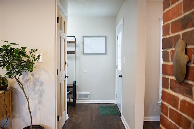 hallway with dark wood-type flooring