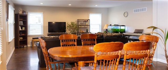 dining room with dark wood-type flooring