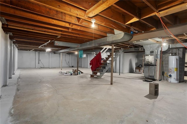 basement with water heater and heating unit