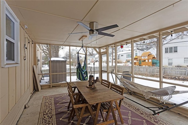 sunroom / solarium with a wealth of natural light and ceiling fan