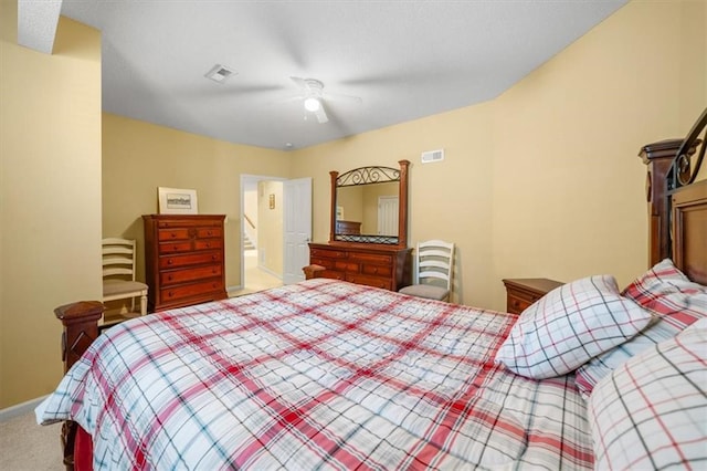 bedroom with baseboards, carpet, visible vents, and ceiling fan