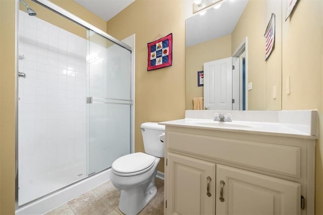 full bathroom featuring tile patterned flooring, a stall shower, toilet, and vanity