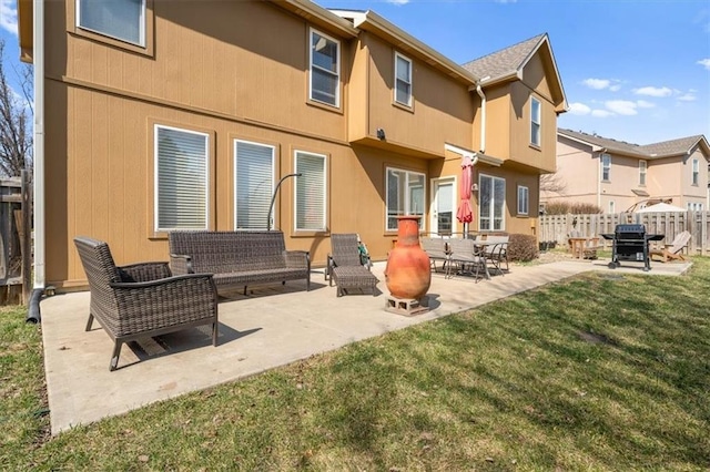 rear view of house featuring fence, a residential view, outdoor lounge area, a patio area, and a lawn