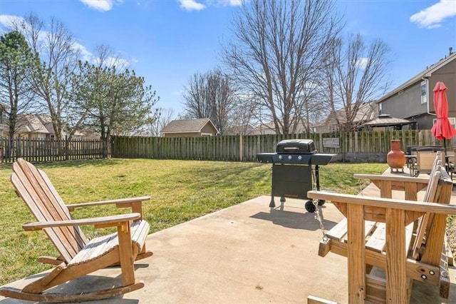 view of patio / terrace with area for grilling and a fenced backyard