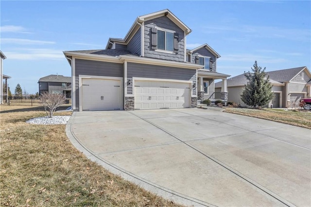 view of front of property with driveway, an attached garage, and a front lawn