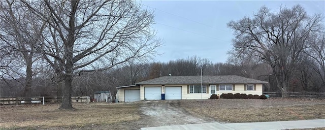 single story home with a garage