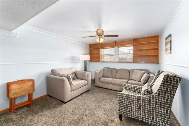 living room with ornamental molding, a ceiling fan, baseboards, and carpet floors