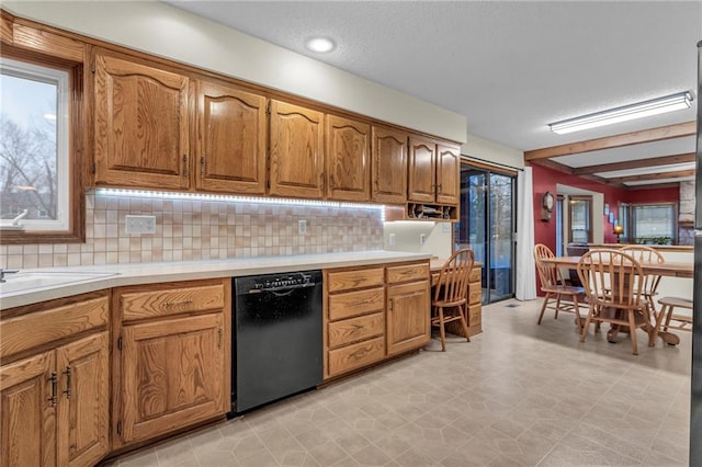 kitchen featuring tasteful backsplash and dishwasher