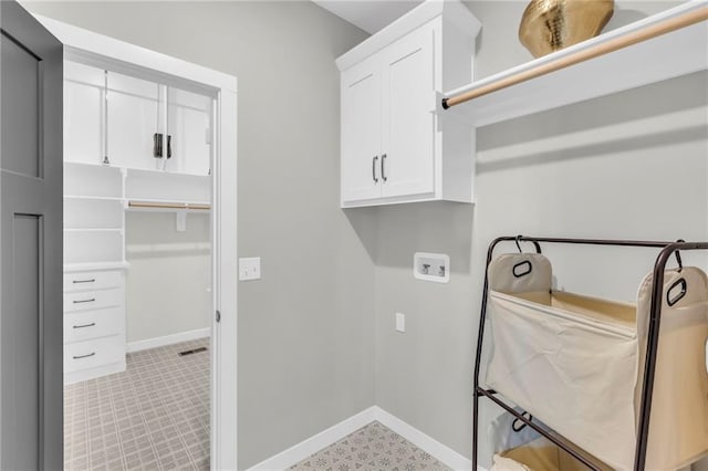 laundry area featuring cabinets and washer hookup