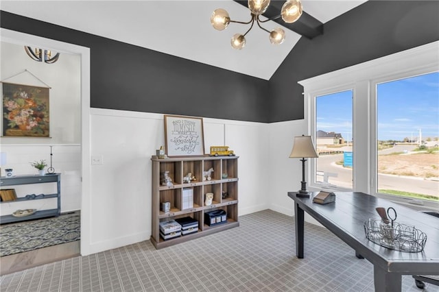 carpeted home office with a notable chandelier and lofted ceiling with beams