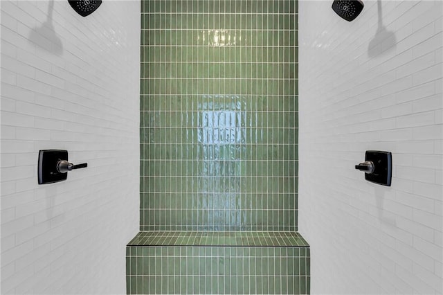 bathroom with tiled shower