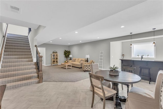 dining space with light parquet floors