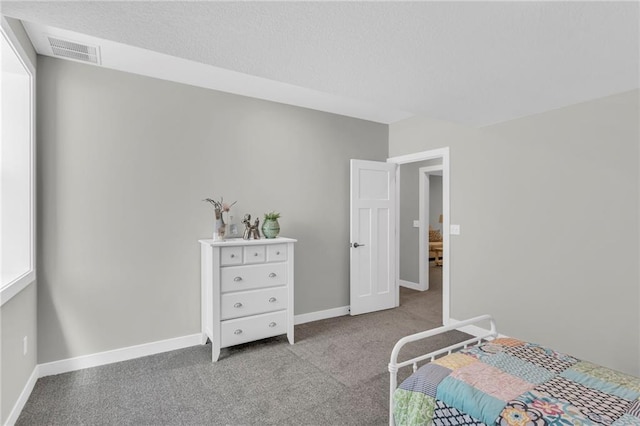 bedroom with light colored carpet