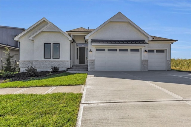 view of front of property featuring a garage and a front yard