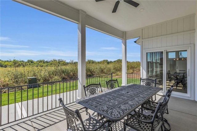 view of patio / terrace with a balcony and ceiling fan