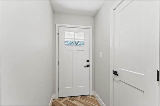 doorway featuring light parquet flooring