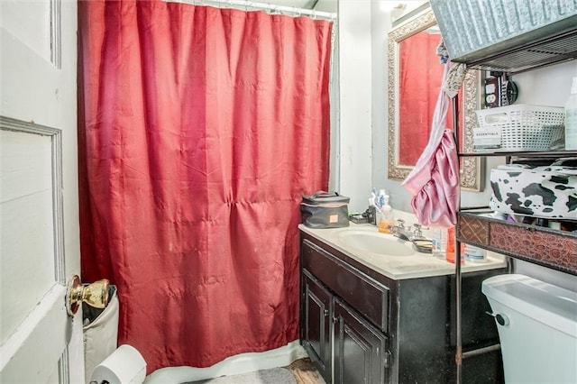 full bath with toilet and vanity