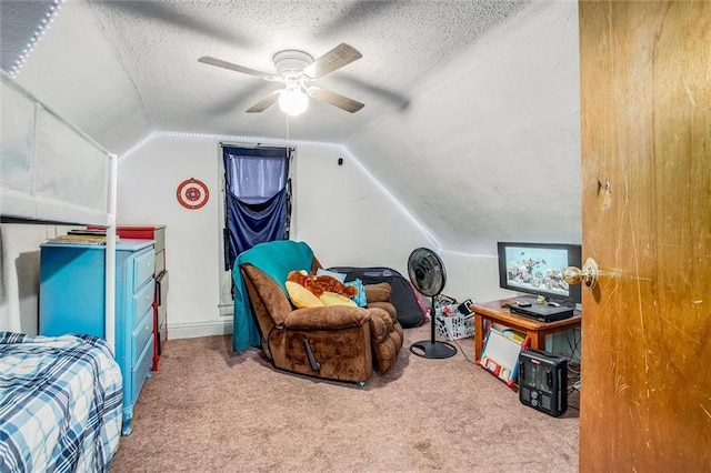 interior space with a textured ceiling, ceiling fan, vaulted ceiling, and light carpet