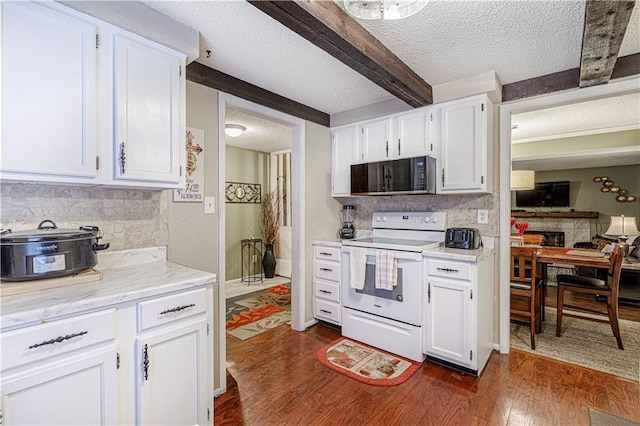 5933 Ridgeway Ave, Kansas City, MO 64133 - kitchen featuring white range with electric stovetop, dark wood-style flooring, a textured ceiling, and beam ceiling