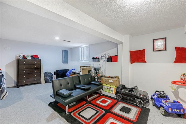 5933 Ridgeway Ave, Kansas City, MO 64133 - exercise room featuring electric panel and a textured ceiling