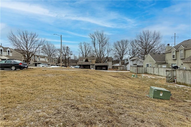 5933 Ridgeway Ave, Kansas City, MO 64133 - view of yard featuring a residential view and fence