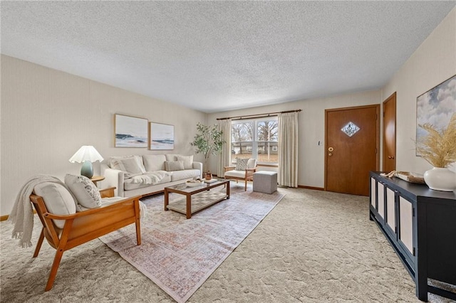 living room featuring carpet and a textured ceiling