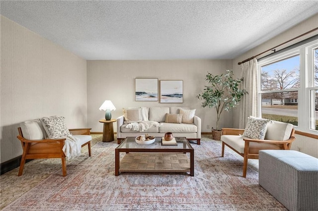 living room featuring light colored carpet and a textured ceiling