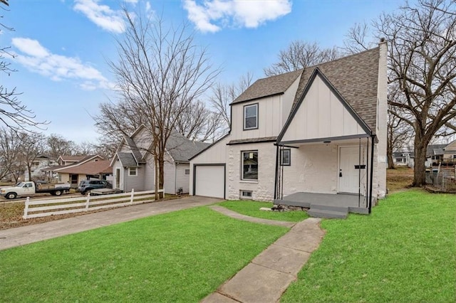 view of front of house with a porch, a garage, and a front yard