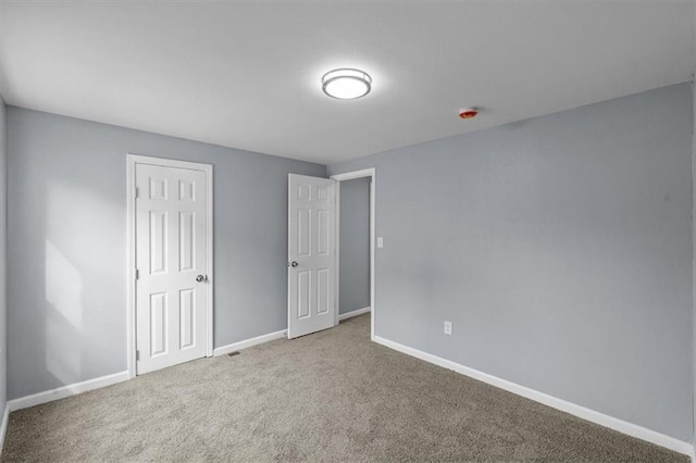 1111 Main St, Osawatomie, KS 66064 - unfurnished bedroom featuring carpet flooring and baseboards