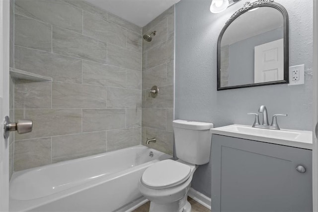 1111 Main St, Osawatomie, KS 66064 - full bathroom with vanity, washtub / shower combination, and a textured wall