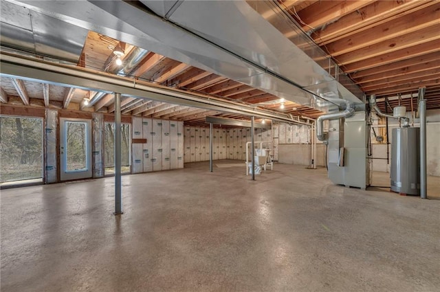 basement featuring heating unit and gas water heater