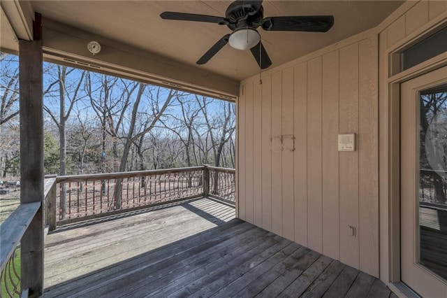 wooden terrace featuring ceiling fan