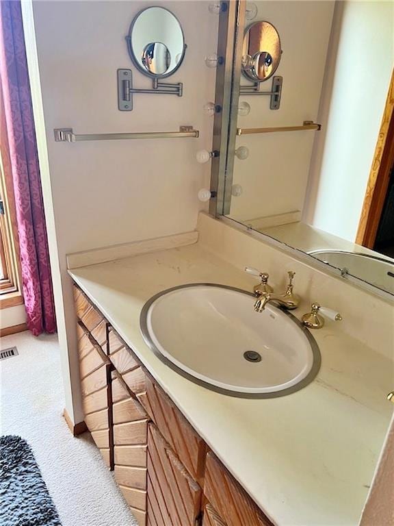 bathroom with visible vents and vanity