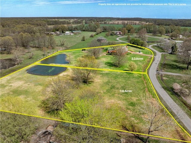 aerial view featuring a water view and a rural view