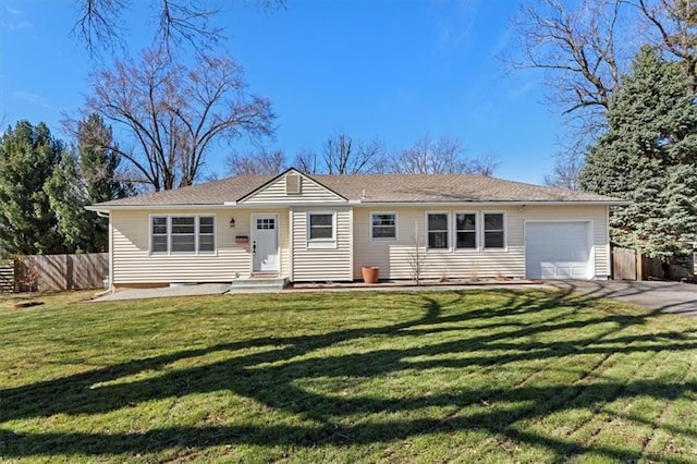 ranch-style house with a garage, driveway, fence, and a front lawn