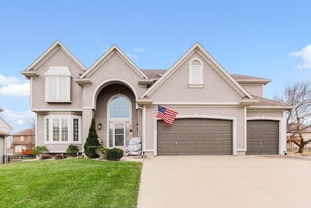 front of property with a garage and a front yard