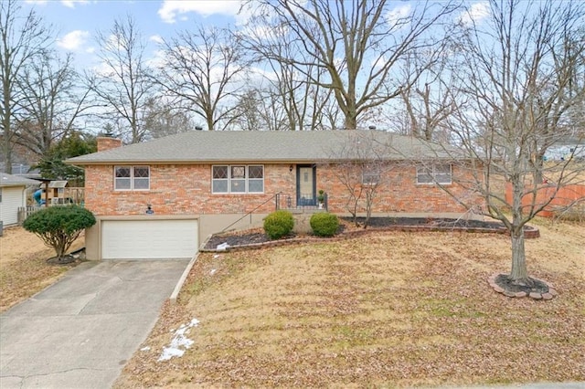 view of front of house with a garage and a front lawn