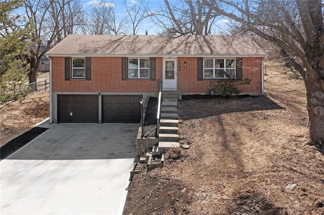 ranch-style house featuring a garage, concrete driveway, and brick siding