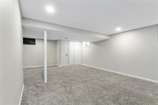 basement with carpet floors and baseboards