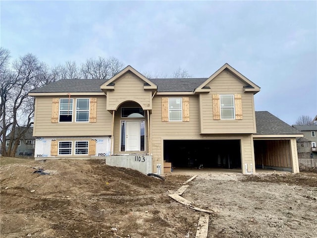 bi-level home featuring a garage