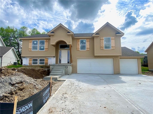 1103 Noah Ln, Kearney, MO 64060 - bi-level home with an attached garage and driveway